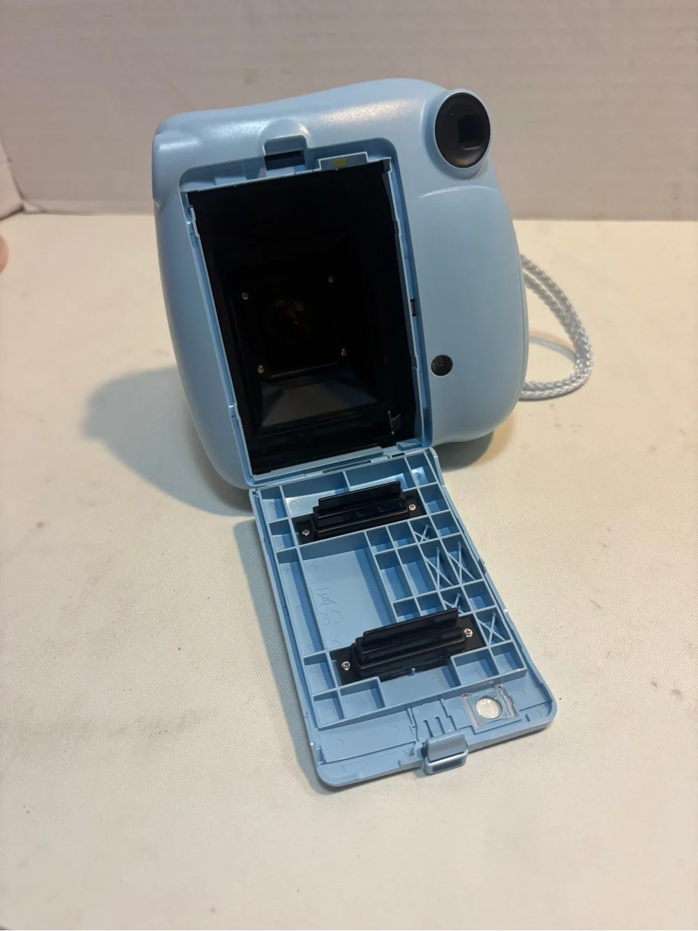 Fujifilm Instax Mini 7+ instant camera blue photos